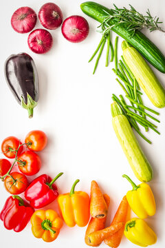 Colorful vegetables for healthy diet. Paprika, tomatoes, carrot, zucchini, eggplant on white background top view copyspace