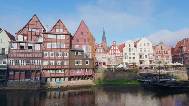 The historic old town of L&uuml;neburg lies along the River Ilmenau in Lower Saxony, northern Germany. Traditional red brick buildings, medieval gabled houses, historic waterfront fa&ccedil;ades and cobbleston