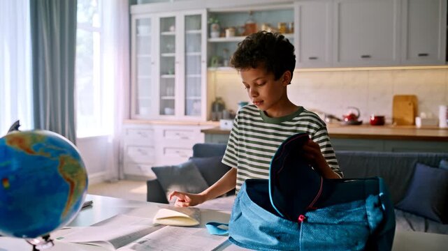 Pupil packing school backpack kitchen. Mother handing lunchbox water bottle.