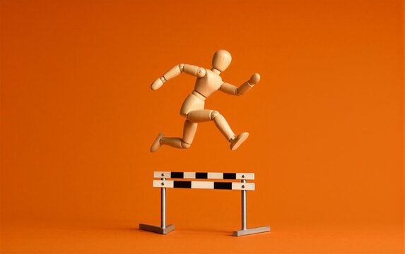 Wooden figure leaps over hurdle against vibrant orange background.
