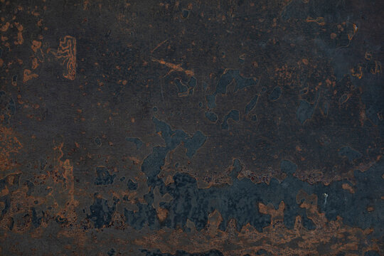 weathered and distreesed surface background black, blue and rust tones