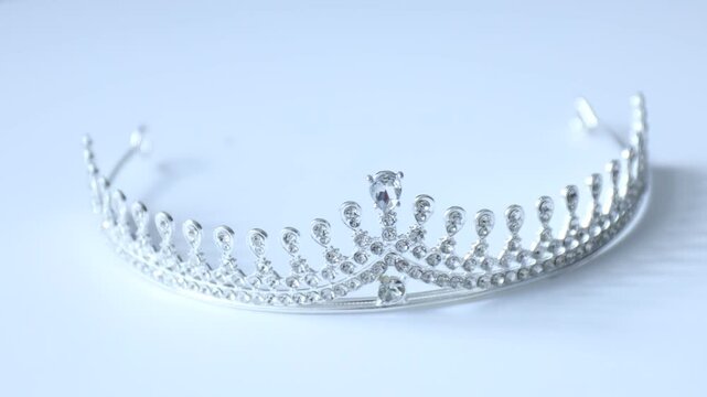 Bridal hair accessory. Beautiful tiara on white background, rotating
