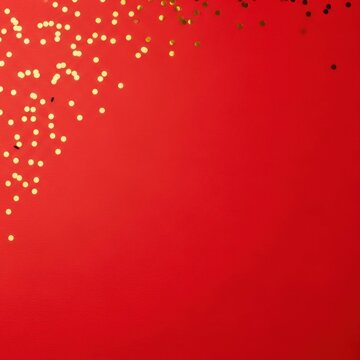 Minimalist solid red paper background featuring golden circular glitter confetti scattered in the top left corner with ample copy space for festive holiday text and designs.