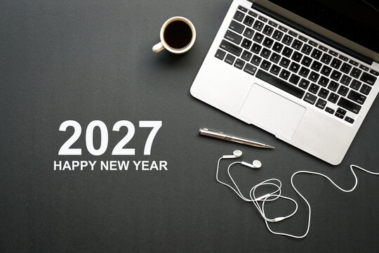 2027 Happy New Year on work desk. Top view. 