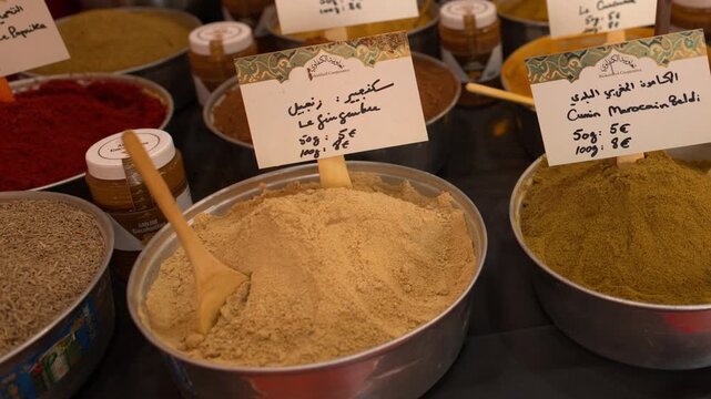Colorful Bowls of Various Powdered Spices and Seasonings on Display