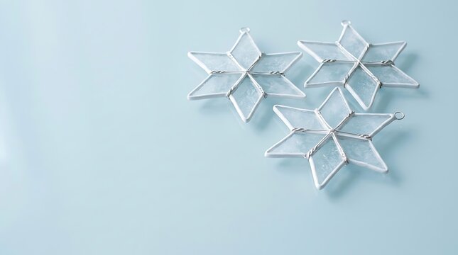 A serene and minimalist hanukkah scene featuring delicate paper stars against a pale blue backdrop