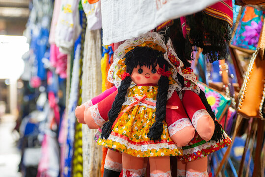 Traditional Handmade Doll in Colorful Mexican Dress at a Market