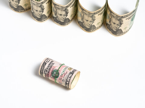 Rolled Stack of Fifty Dollar Bills Secured with a Green Rubber Band