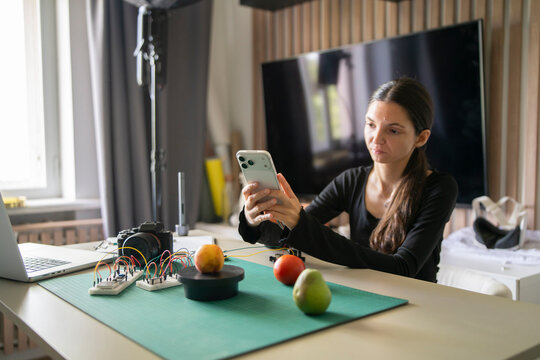 Woman Photographing Apple on Weight Sensor Scale for AI Object Recognition Data