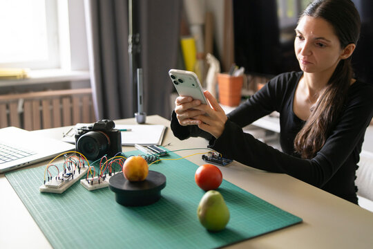 Engineer Capturing Apple Weight Data With Smartphone for AI Recognition Testing
