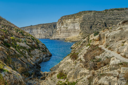 Coastal Landscape of Gozo Cliffs and Winding Path Toward the Sea