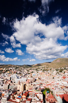 Guanajuato cityscape with colorful buildings and cloudy sky