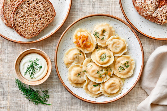 Traditional Ukrainian Varenyky with Sour Cream and Caramelized Onions
