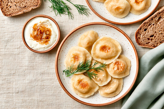 Traditional Ukrainian Varenyky with Sour Cream and Caramelized Onions