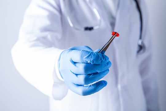 Doctor holding a syringe with a vaccine in his hands, close-up