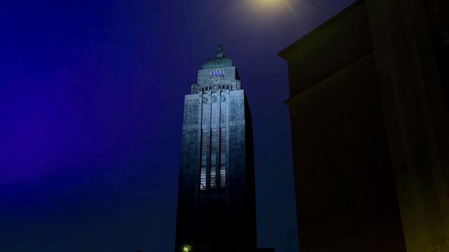 Kallio Church Tower and Street Lamp Against a Deep Blue Night Sky