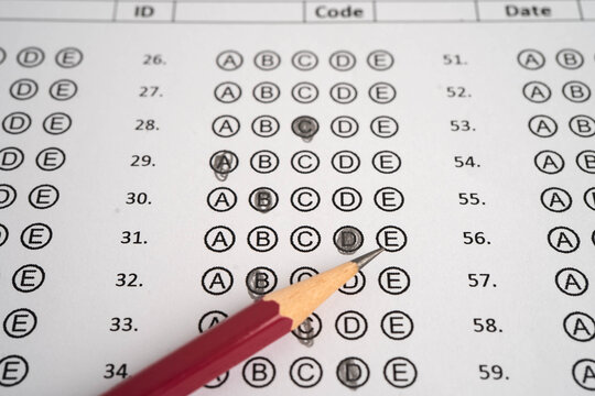 Answer sheets with pencil drawing fill to select choice, education.