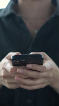 woman holds smart phone in her hands and scrolls through the news feed. Close up of hand uses mobile. point finger on screen, texting text message.