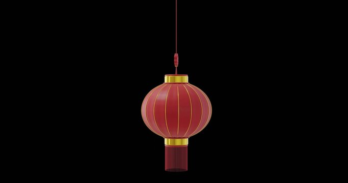 Red lantern hanging from thin red cord with gold bands and red tassel against black background