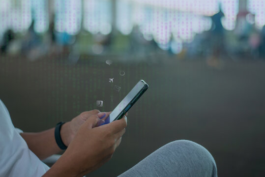 Close up of person hands using smartphone with social media icons and digital data matrix background