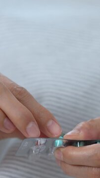 close up woman hand holding a medicine Anti-inflammatory. Stop drug use Taking Medication Caring for the health care medical concept.	
