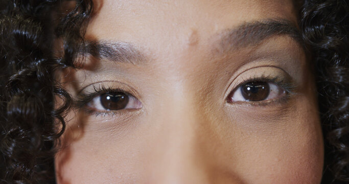 Portrait of eyes of casual businesswoman in office