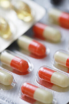pills capsule on to surface tablets. drug medical healthcare pharmacy concept. pharmaceuticals antibiotics medicine in blister packs.	