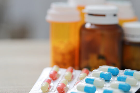 Pill bottle. colorful pills capsule on to surface tablets. drug medical healthcare pharmacy concept. pharmaceuticals antibiotics medicine in blister packs.	