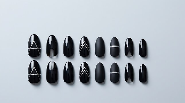 Set of black false nails with modern geometric silver line art designs for elegant finger manicure. Gothic nail inspiration