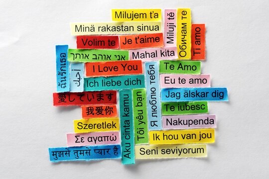 Colorful paper strips displaying &ldquo;I love you&rdquo; in multiple languages, celebrating linguistic diversity, romantic expression, cultural connections, and universal love across the world.