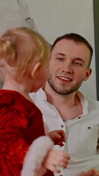 A Heartwarming Family Moment: Joyful Interactions Captured Between Loved Ones in a Cozy Setting, Highlighting Smiles, Connection, and Affection Among Family Members