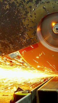 Cutting Process in Industrial Manufacturing: A Close-Up View of a Circular Saw Blade Generating Sparks and Precision in Metalwork Transformation