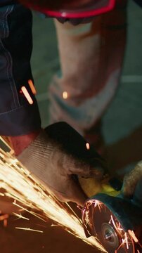 Craftsmanship in Action: A Skilled Artisan Working with Tools and Creating Sparks While Wearing Safety Gear and Focused on the Task at Hand