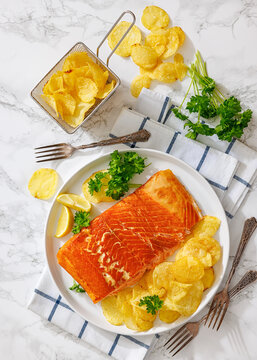 Canadian hot-smoked salmon piece with potato chips