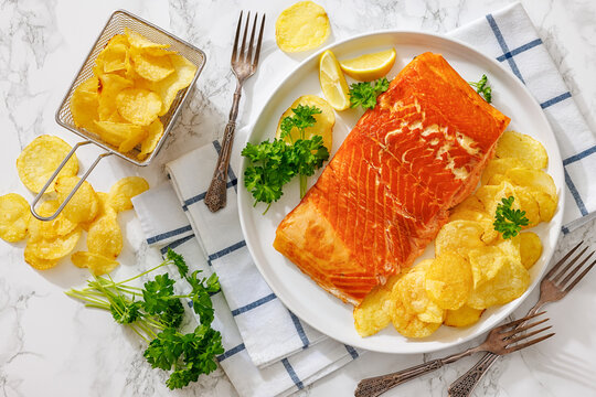 Hot smoked salmon fillet with potato chips
