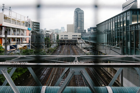 Train tracks in downtown Tokyo on a cloudy day