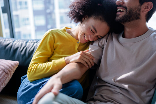 Man and woman sharing moments of love at home