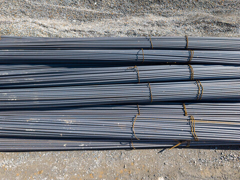 Aerial View Of Bundled Construction Rebar Stacks On Site