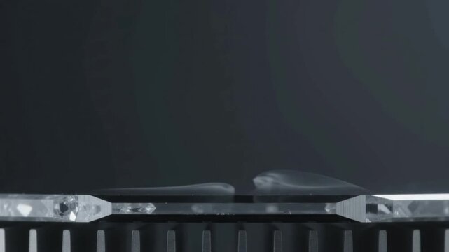 Macro shot of static semiconductor wafer edge with subtle cryogenic thermal vapor pulse, dark minimalist copy space for advanced technology hardware background.