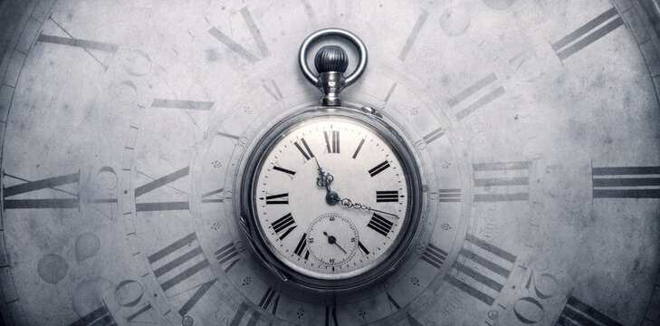 The old antique classic clocks on a vintage wide paper background. Concept of time, history, science, memory, information. Retro style. Vintage clockwork aand watch background.