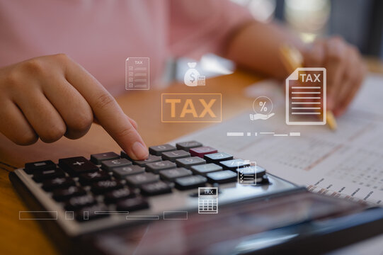 Woman accountant calculating annual car tax, income and expense calculations, and analyzing trading reports concepts of annual vehicle tax, and financial and tax systems.