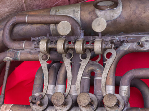 Close Up View of Vintage Brass Tuba Rotary Valves and Mechanical