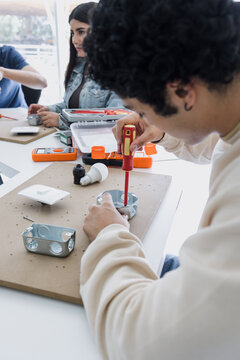 group of latin american students in an electricity class or electrical circuits at university in Mexico