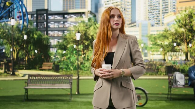 Smartwatch time check heightens the concern of a businesswoman waiting in the city park; she scans her surroundings with an impatient, anxious look during a busy professional workday.