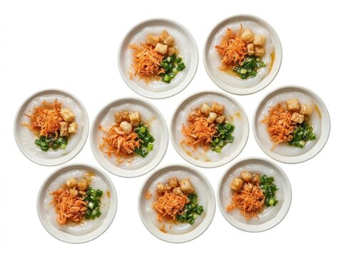 Traditional Vietnamese banh beo steamed rice cakes in small ceramic dishes topped with shrimp flakes and crispy pork cracklings on a white background