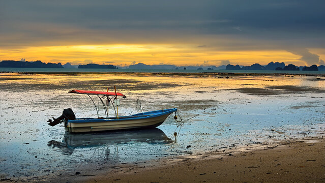 Boat at sunset in Krabi, Thailand.