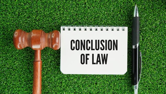 Judge's gavel and paper with the word conclusion of law is a judge's final decision or ruling on how the applicable legal rules, statutes, or principles apply to the established facts of a case.