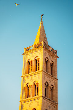 Zadar, Croatia. Old town street of Zadar with the Church of St. Donatus and the bell tower of the Cathedral of St. Anastasia at sunset.