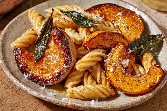 Roasted pumpkin pasta with crispy sage and parmesan cheese gourmet dish