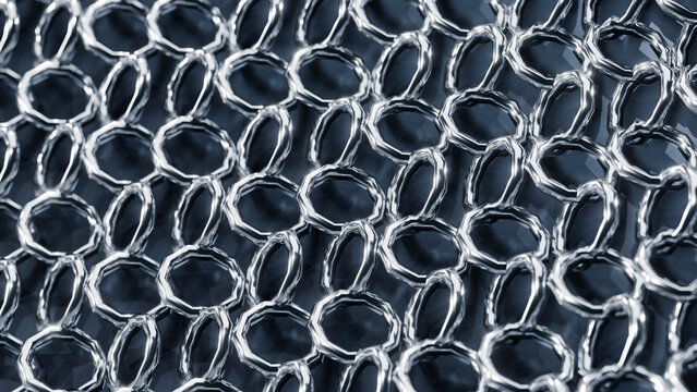 Close-up of interconnected metal rings forming chainmail pattern
